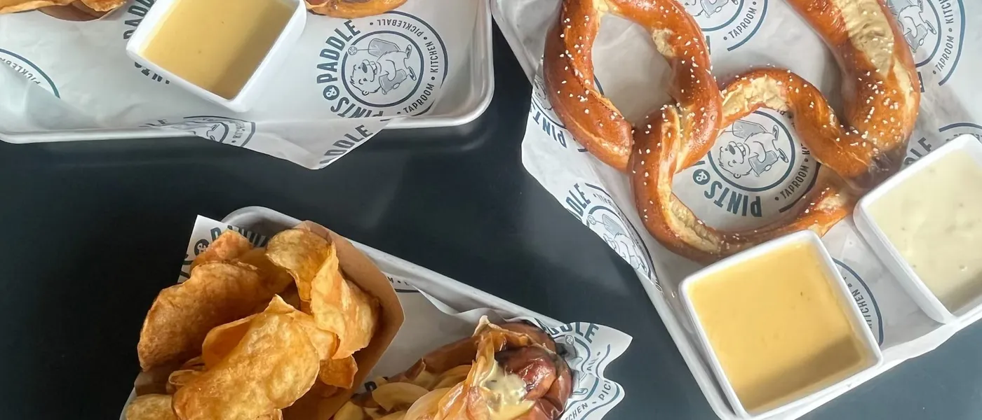 Last year's spread on branded trays, a pretzel with beer cheese, the bratwurst and kettle chips